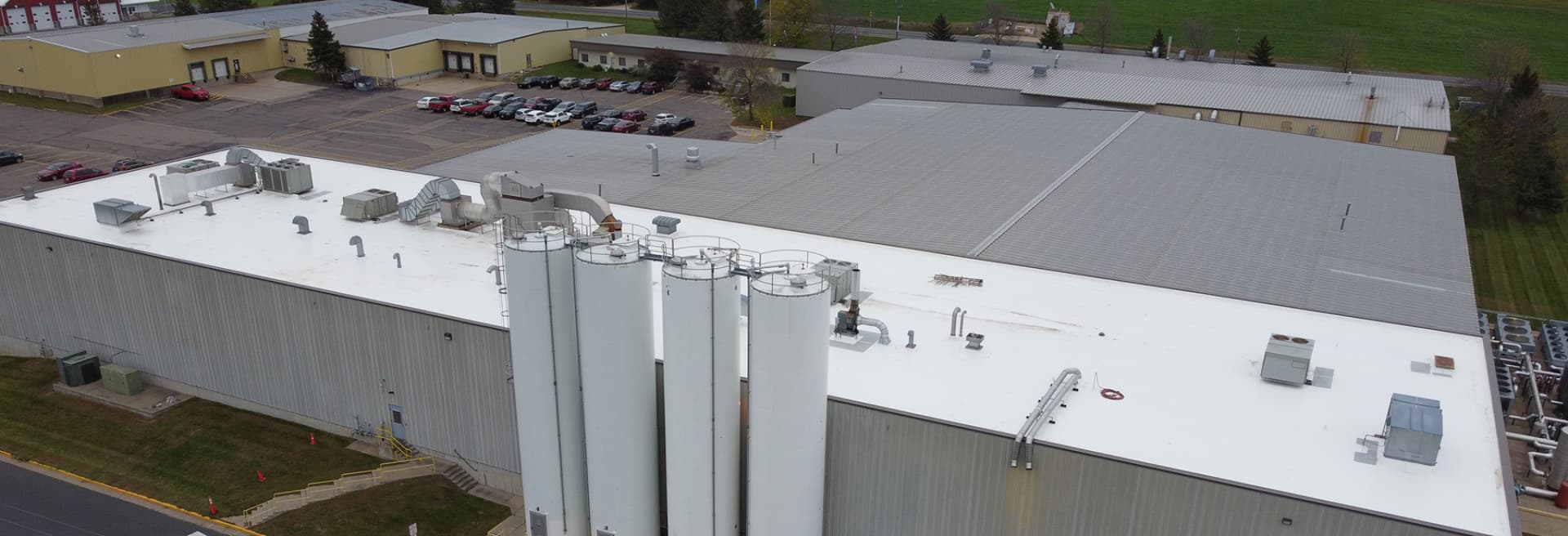 Aerial view of a large industrial flat roof completed by Fischer Roofing